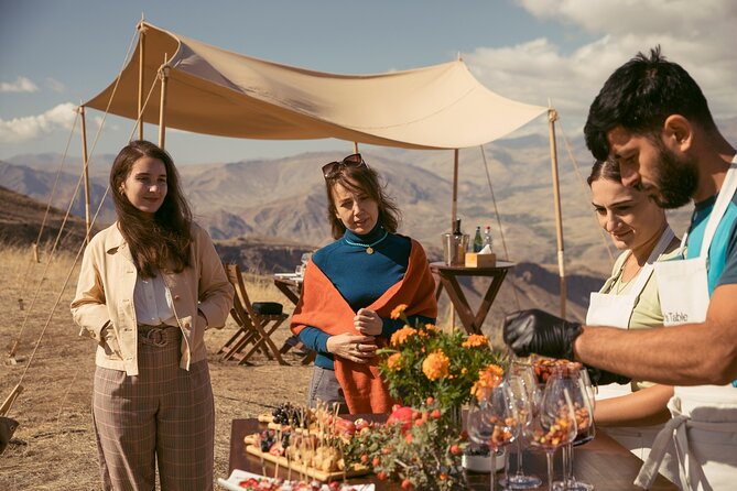 Winemaker's Table: Areni Cliffs - A table with Noravank below